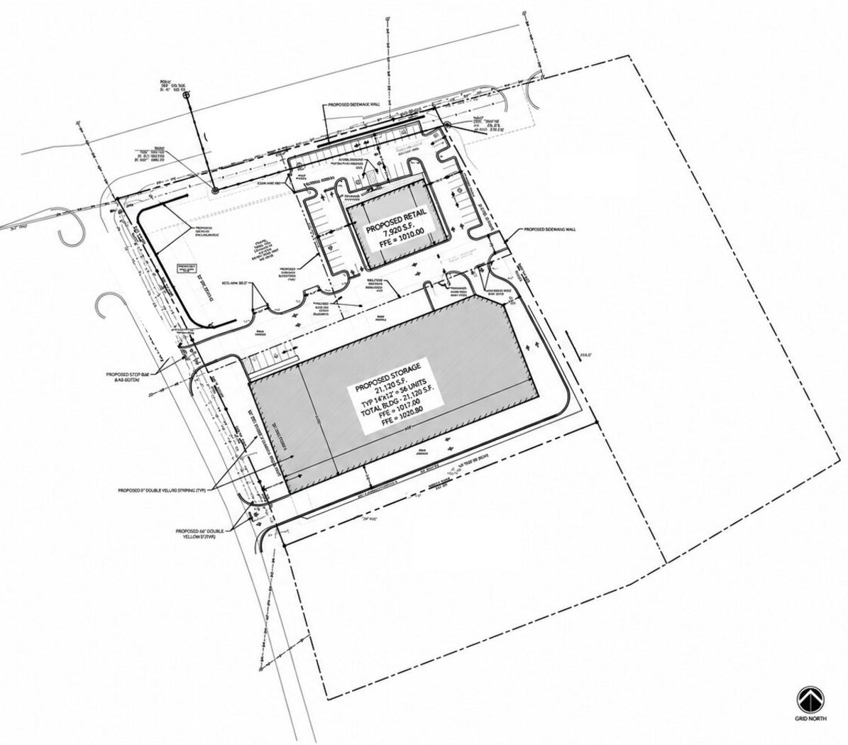 Commercial site plan showing retail and storage building footprints, parking, drive aisles, landscaping, and a north arrow